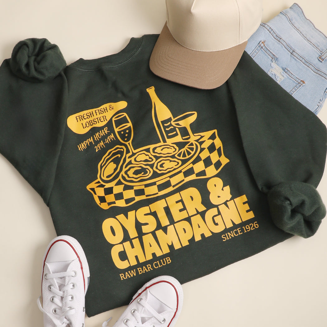 Model wearing Oyster & Champagne graphic sweatshirt