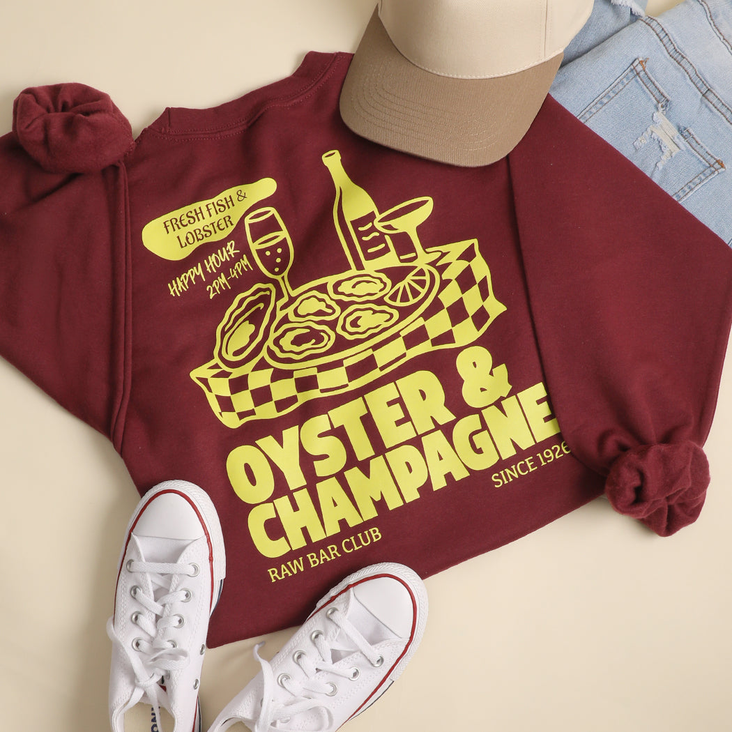 Model wearing Oyster & Champagne graphic sweatshirt