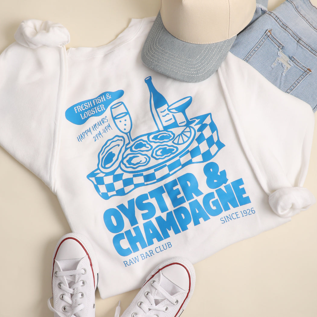 Model wearing Oyster & Champagne graphic sweatshirt