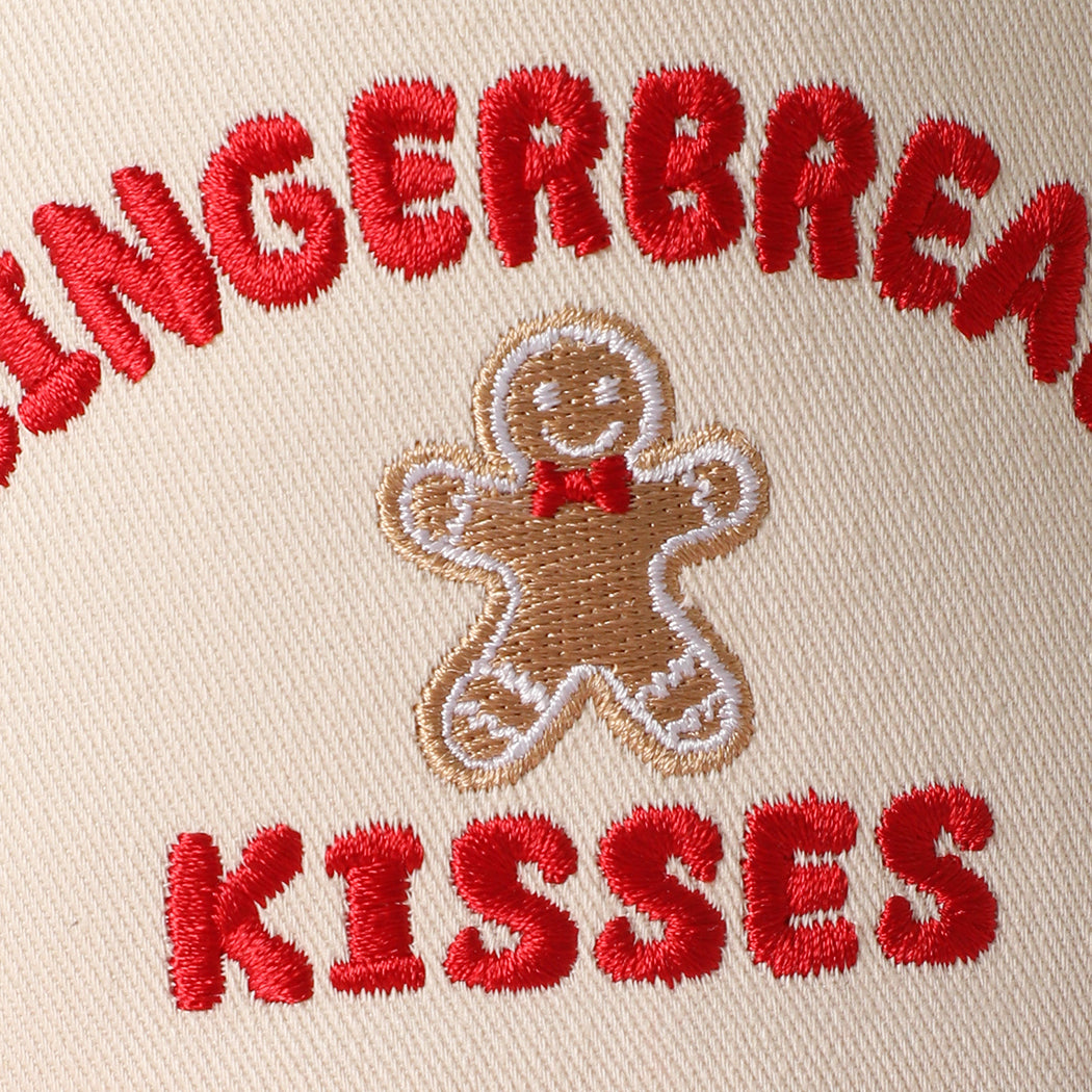Gingerbread Kisses holiday striped brim trucker hat in red, angled view