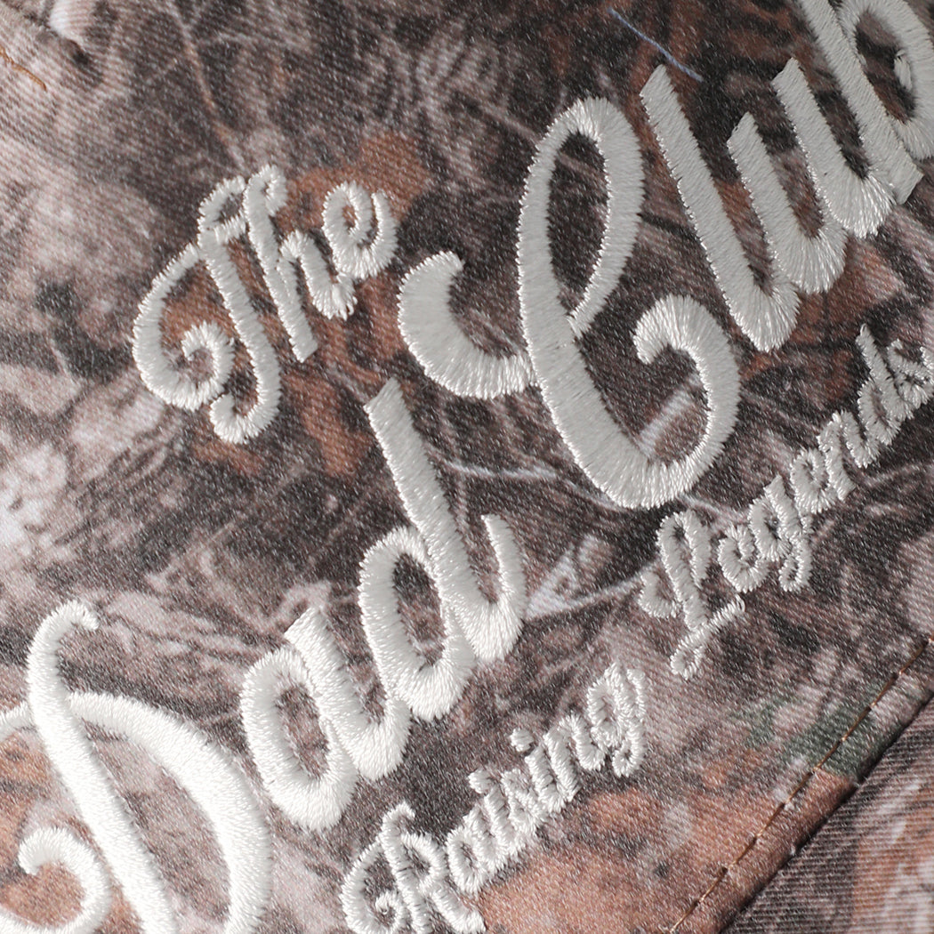 The Dad Club Raising Legends camo trucker hat in dark camo, side view