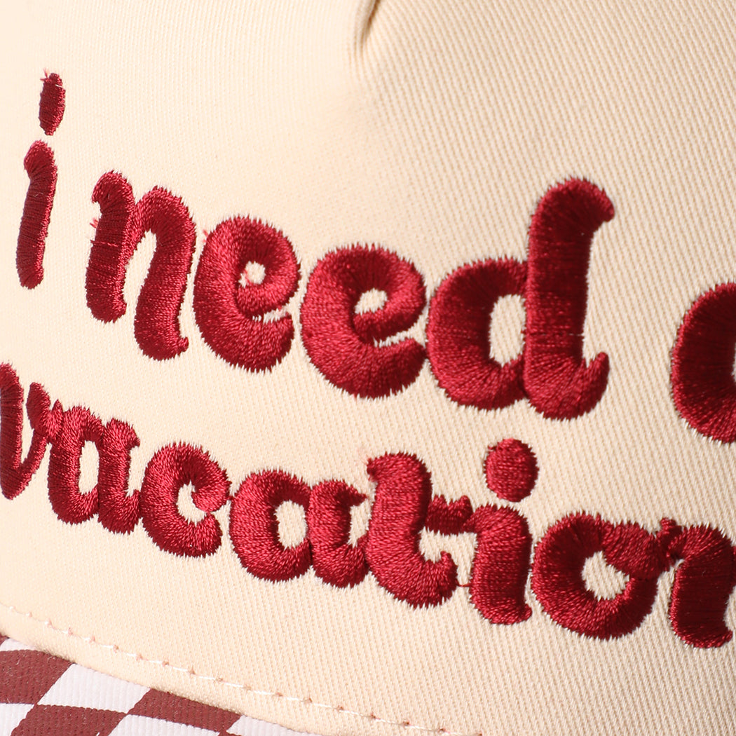 I Need A Vacation checkered brim trucker hat in red, side view