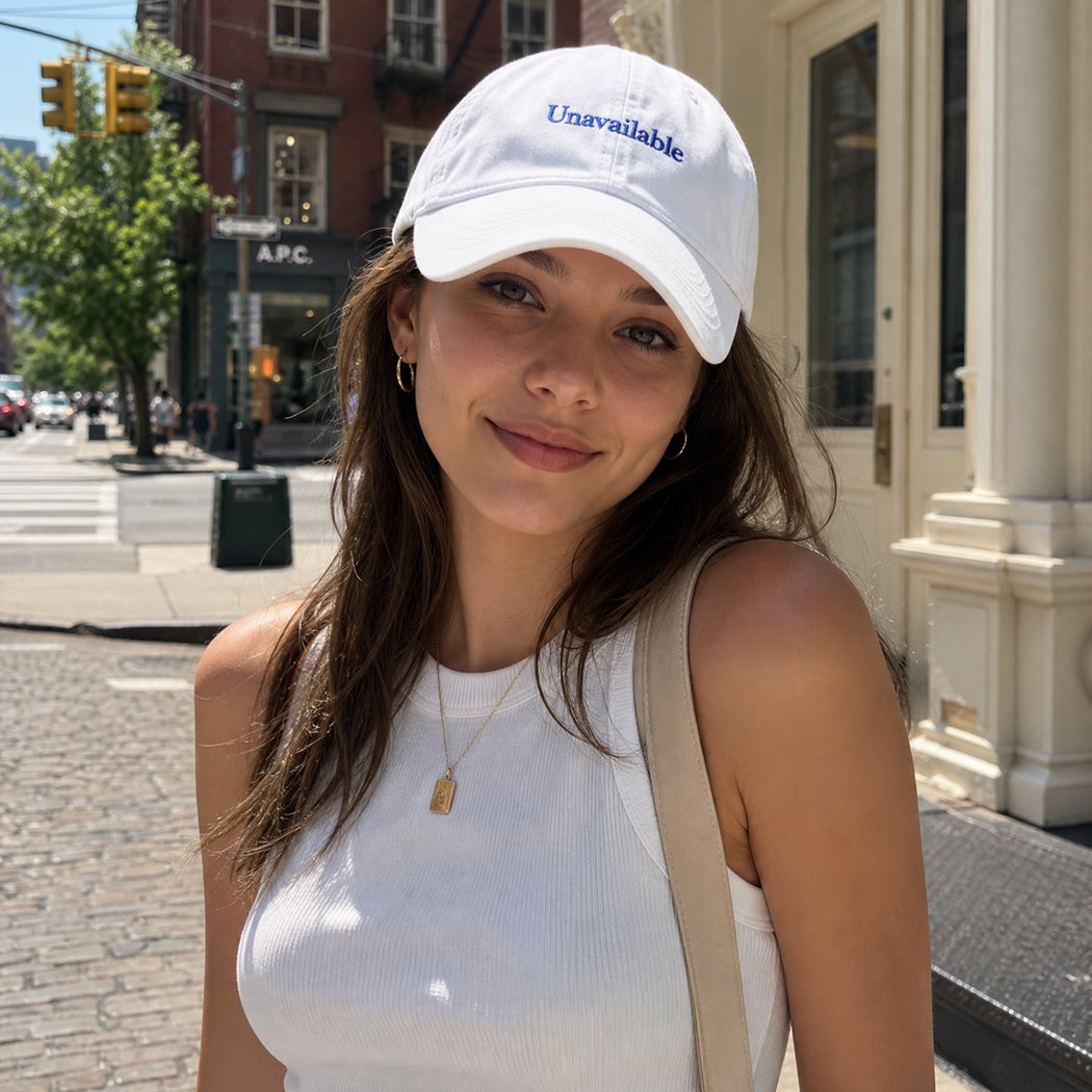 Model wearing Unavailable embroidered baseball cap