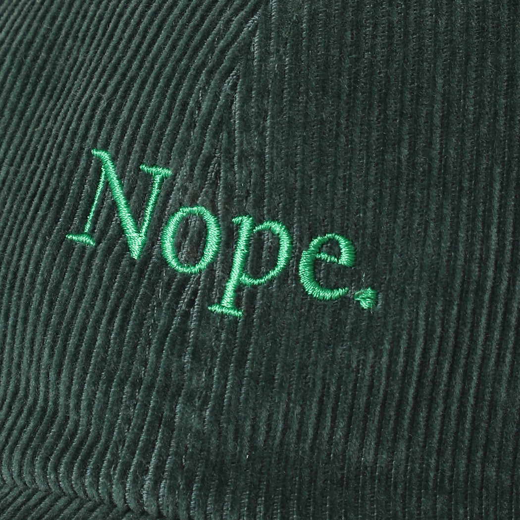 Nope corduroy baseball cap in dark green, side view