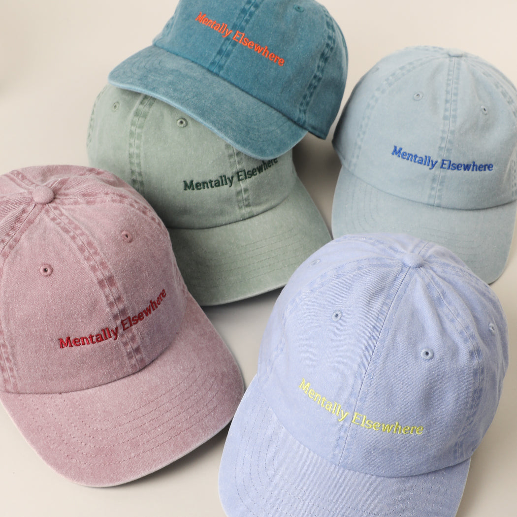 Mentally Elsewhere baseball cap shown in all color options