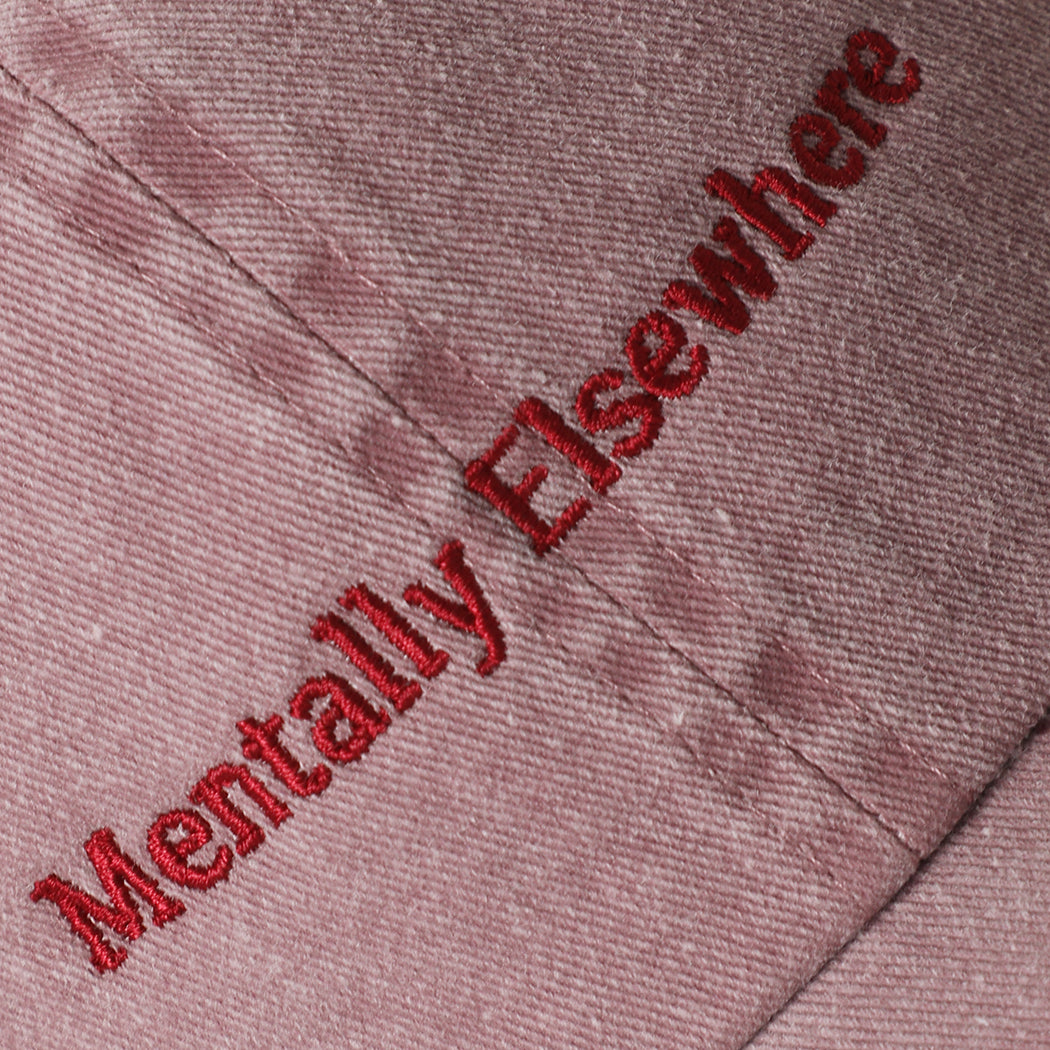 Mentally Elsewhere embroidered baseball cap in mauve, side view