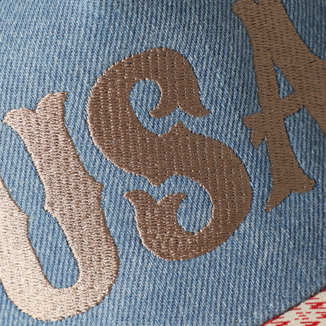 USA embroidered trucker hat in beige, side view