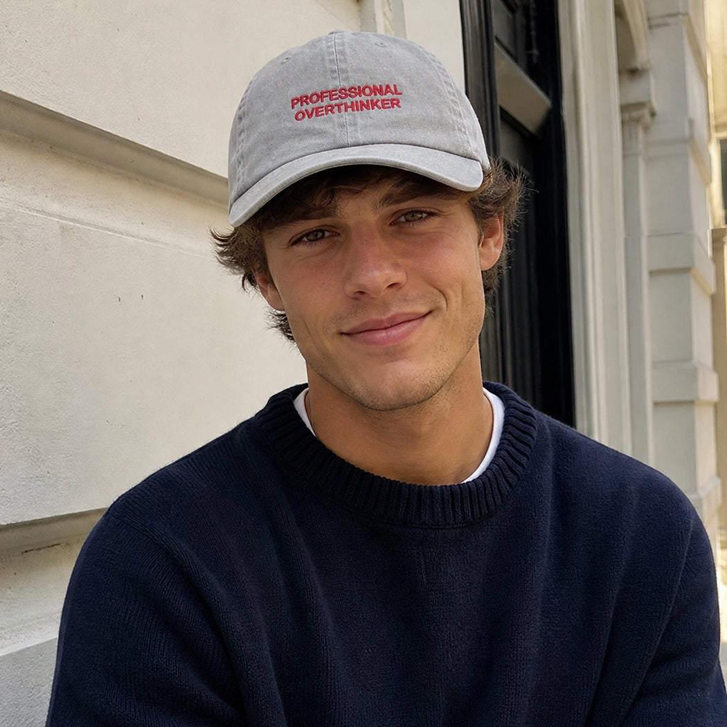 Model wearing Professional Overthinker washed baseball cap