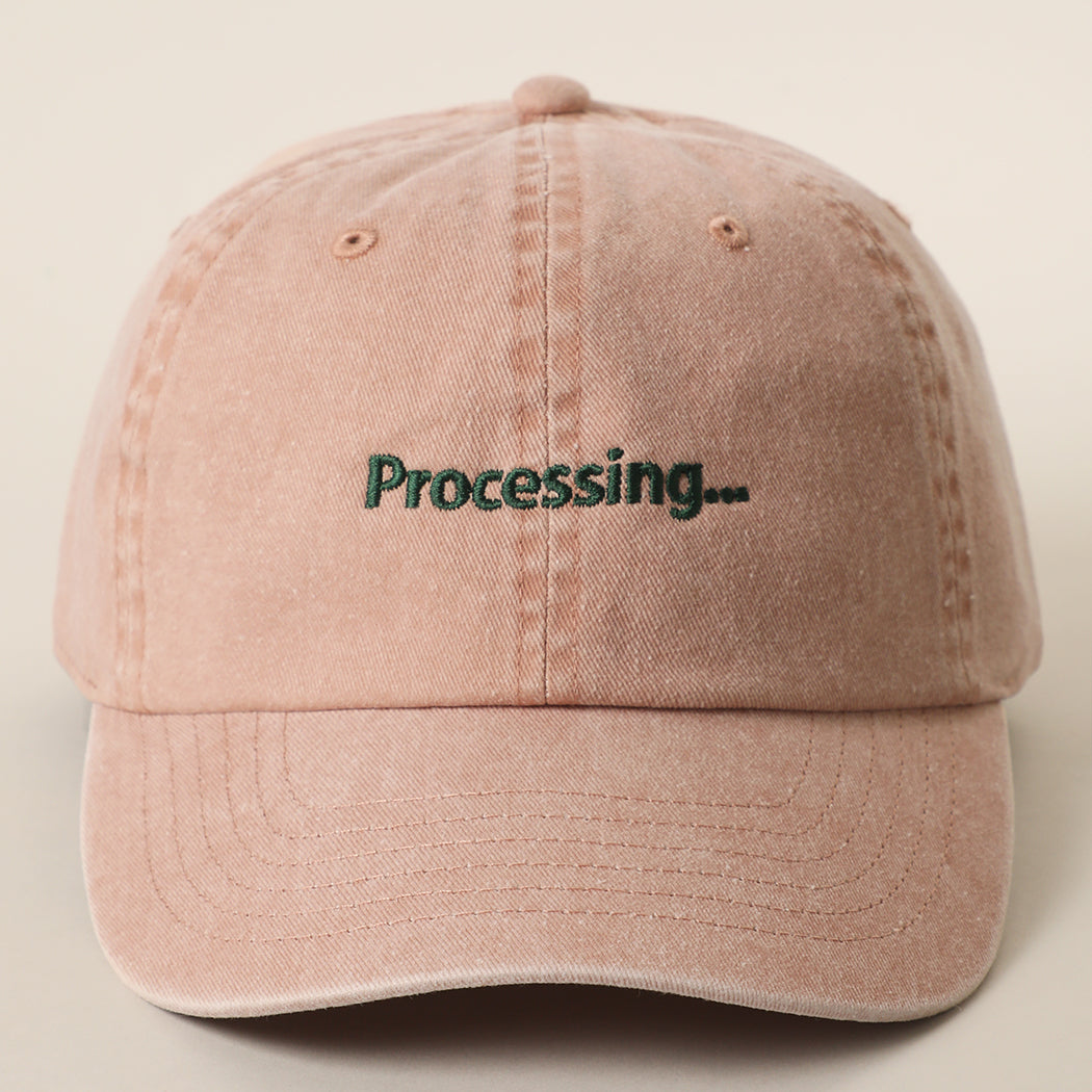 Processing embroidered baseball cap in cinnamon
