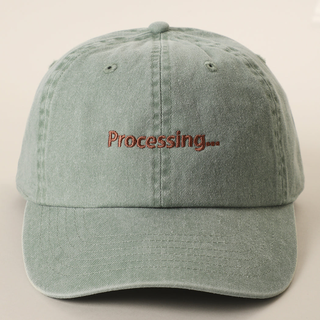 Processing embroidered baseball cap in green tea