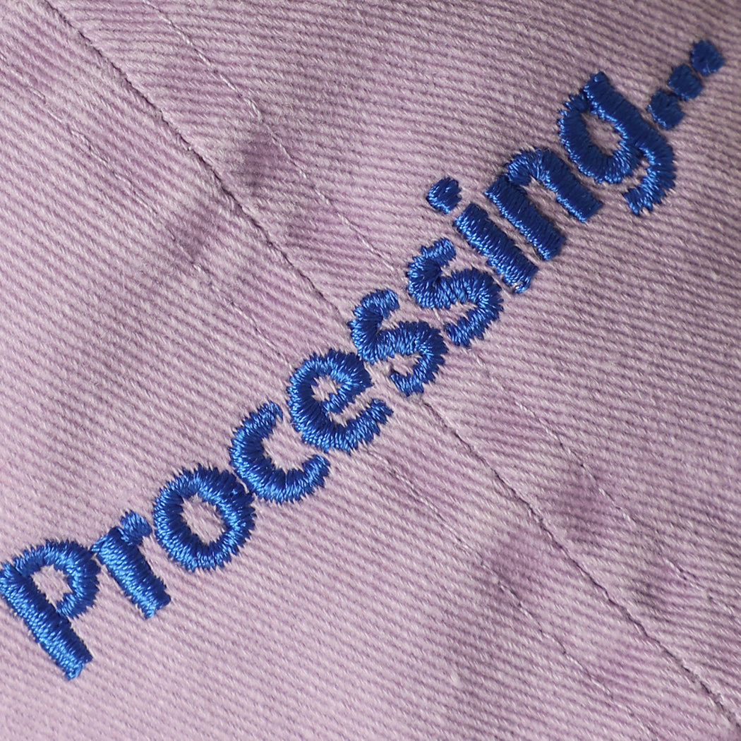 Processing embroidered baseball cap in lilac, side view