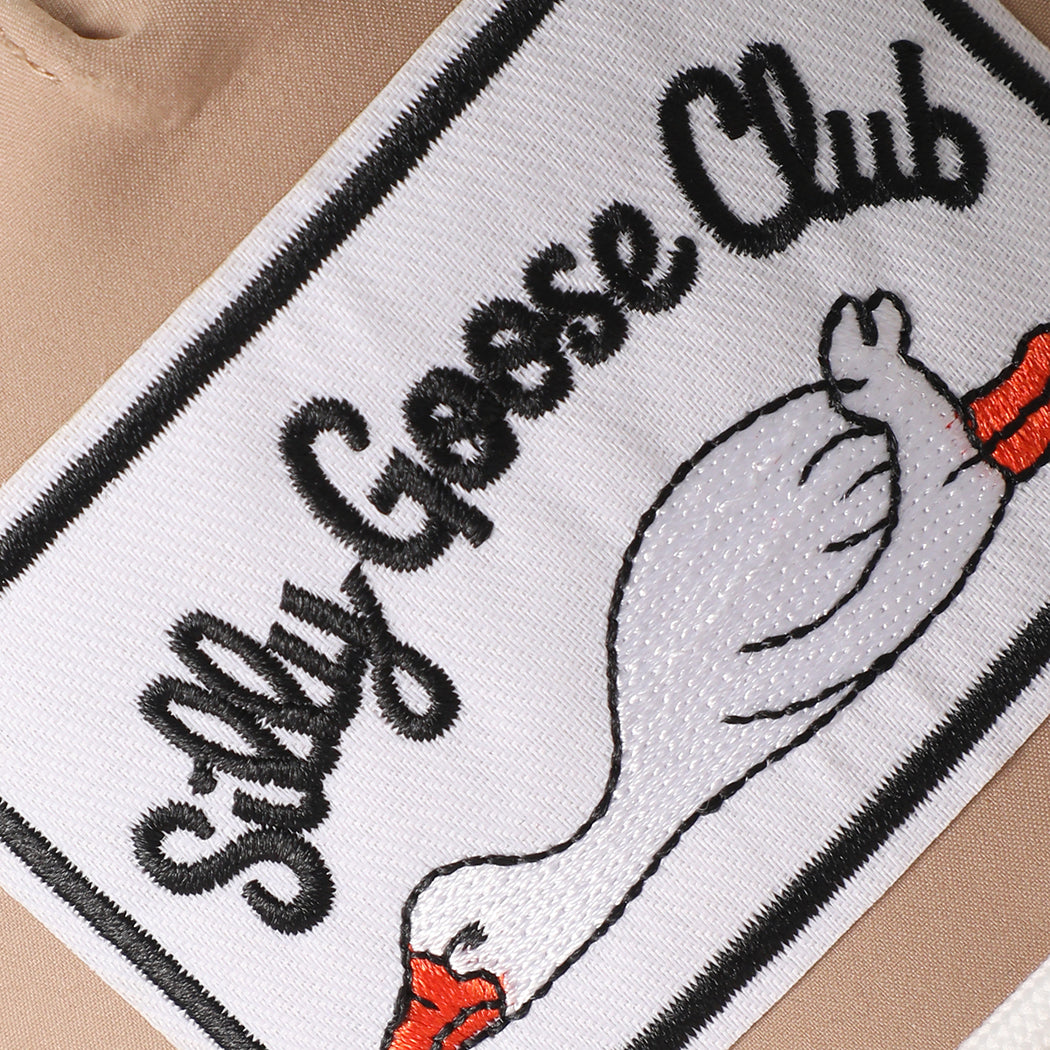 Silly Goose Club patch performance rope hat in sand, side view