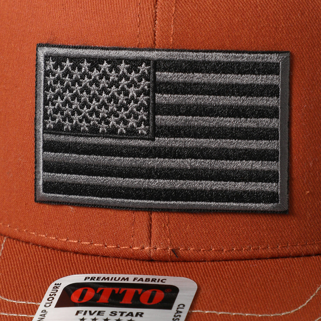 Black American Flag patch trucker hat in orange and khaki, side view