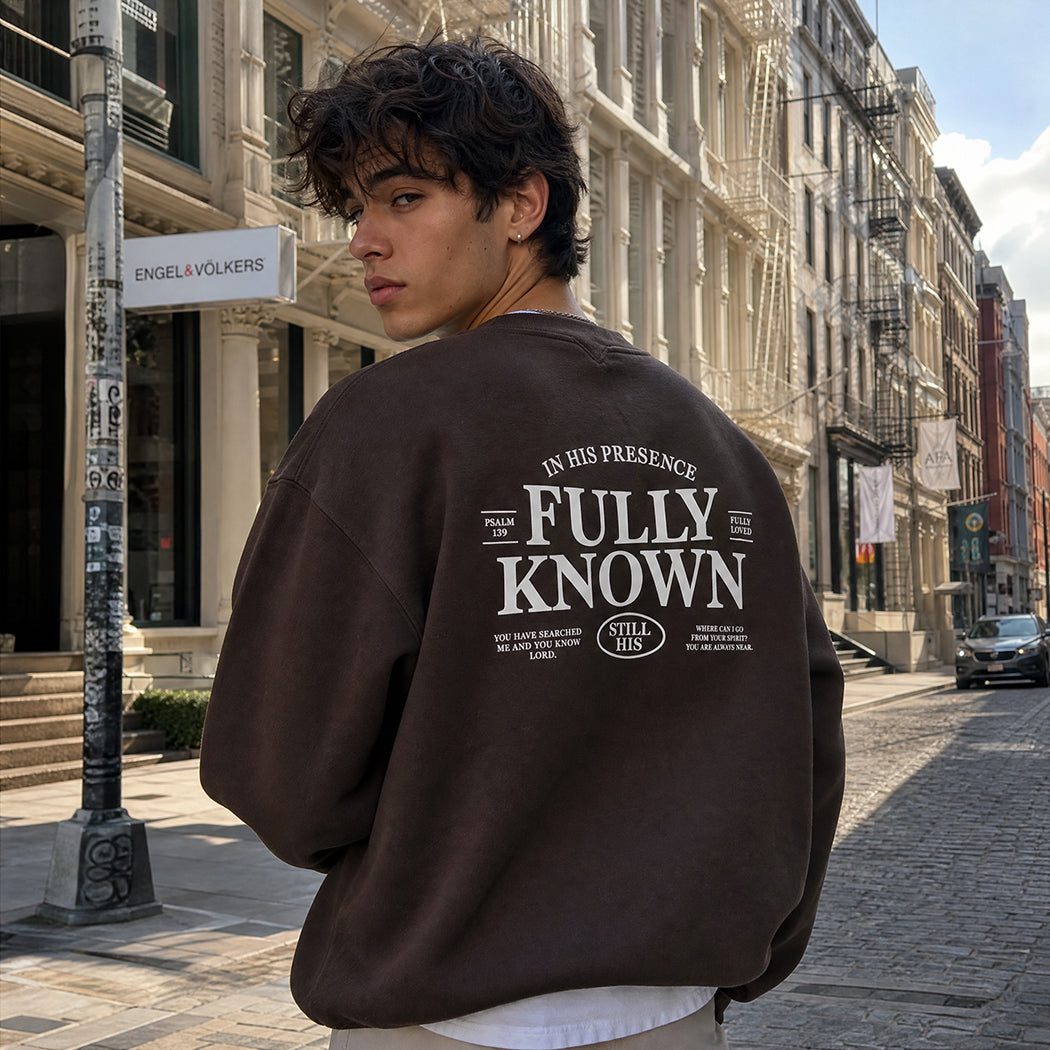 Model wearing Fully Known Psalm 139 graphic sweatshirt, back view