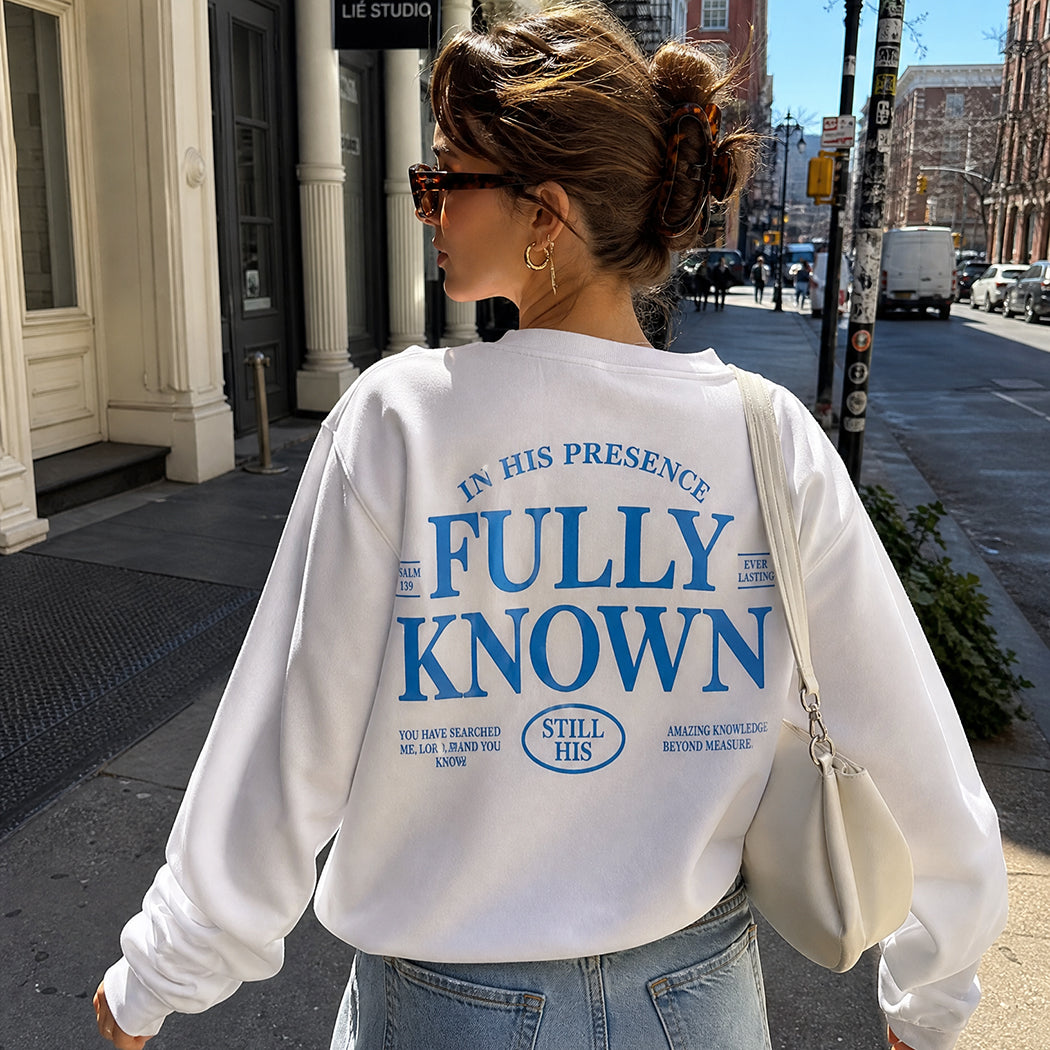 Model wearing Fully Known Psalm 139 graphic sweatshirt, back view