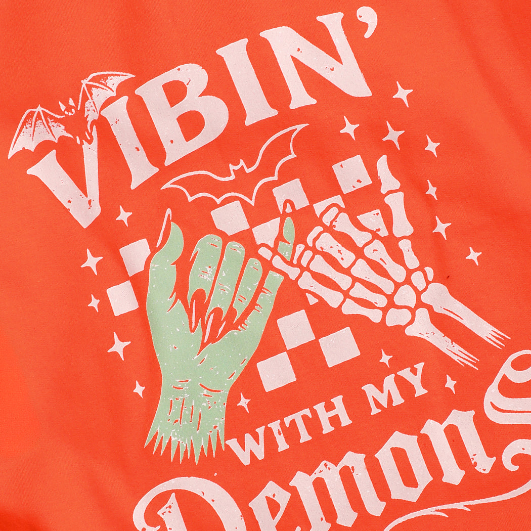 Vibin' With My Demons graphic sweatshirt in orange, detail view