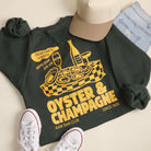 Model wearing Oyster & Champagne graphic sweatshirt