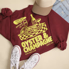 Model wearing Oyster & Champagne graphic sweatshirt