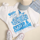 Model wearing Oyster & Champagne graphic sweatshirt