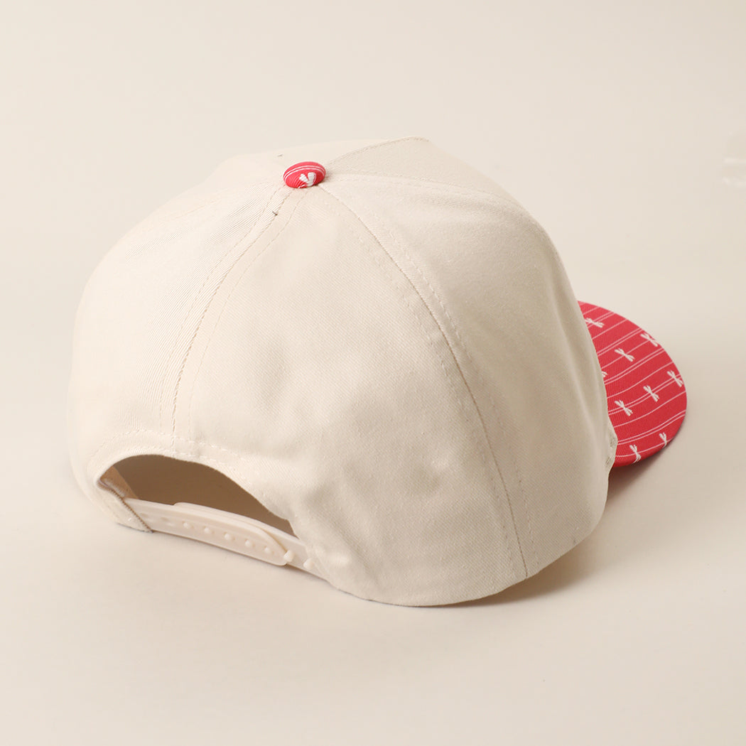 Holly Jolly Honey holiday brim trucker hat in red, side view