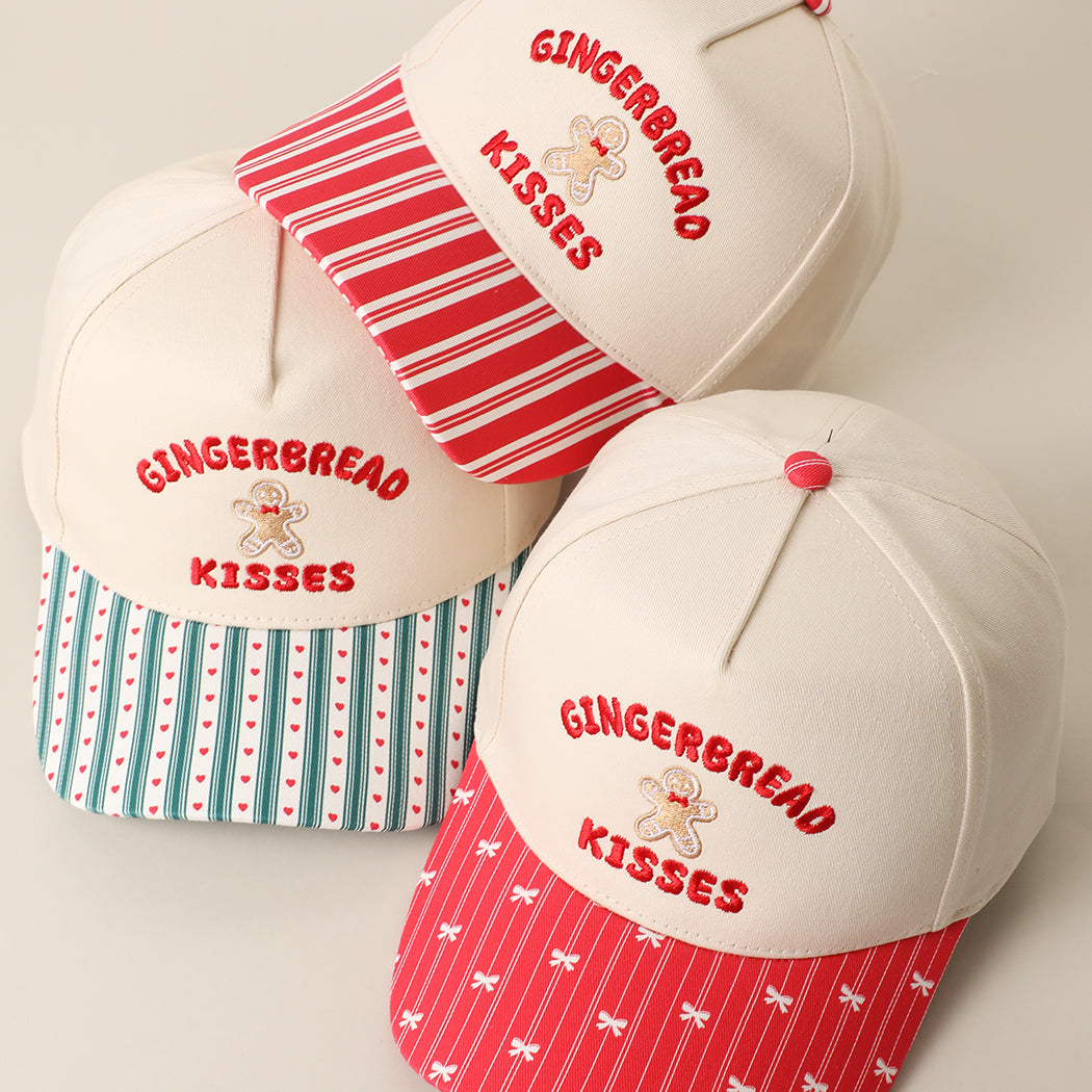 Gingerbread Kisses embroidered holiday brim trucker hats in red and green
