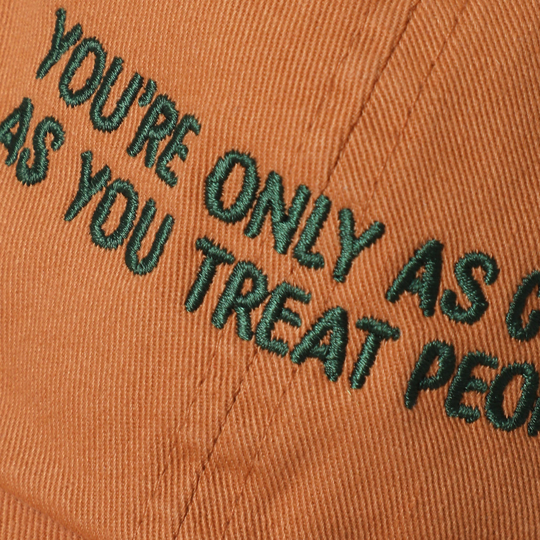 You're Only As Cool As You Treat People cap in copper, side view
