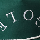 Golf Upside Down rope trucker hat in dark green and white, side view