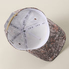 The Dad Club Raising Legends camo trucker hat in dark camo, detail view