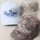 The Dad Club Raising Legends camo trucker hat, front view alternate angle