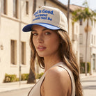 God Is Good Because I Would Not Be embroidered trucker hat, front view