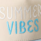 Summer Vibes two-tone trucker hat in light denim, side view
