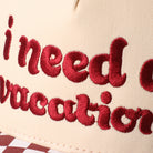 I Need A Vacation checkered brim trucker hat in red, side view