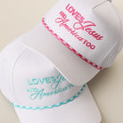 Loves Jesus And America Too rope trucker hat shown in all color options