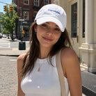 Model wearing Unavailable embroidered baseball cap
