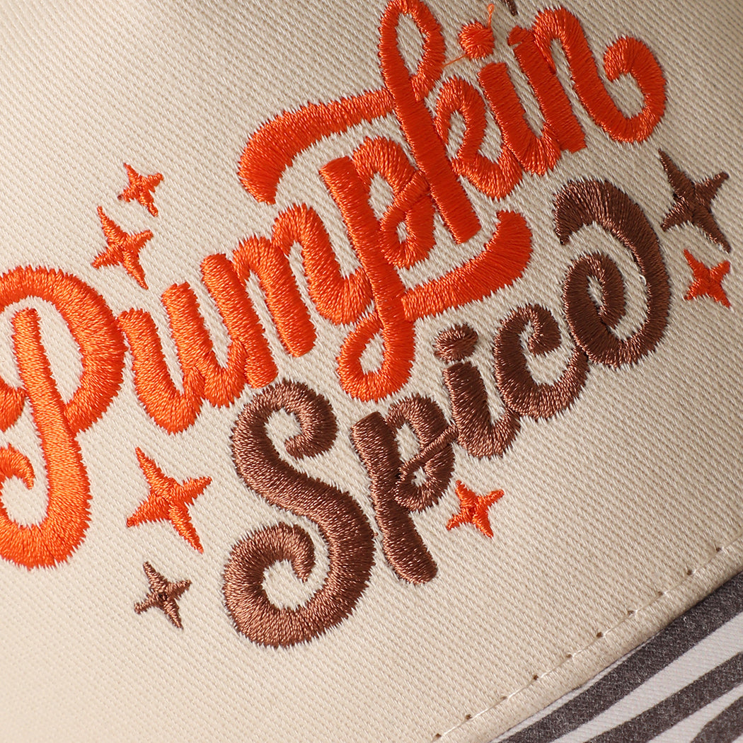 Pumpkin Spice printed brim trucker hat with zebra print brim, angled view