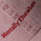 Mentally Elsewhere embroidered baseball cap in mauve, side view
