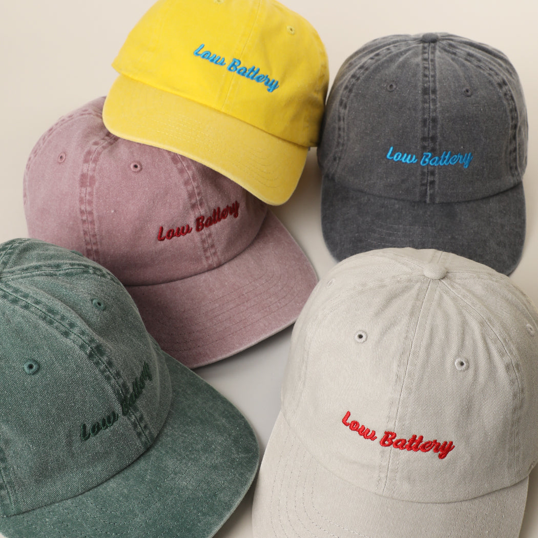 Low Battery embroidered baseball cap shown in all color options