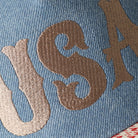 USA embroidered trucker hat in beige, side view