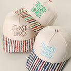 Trust Lord embroidered stripe brim trucker hat, front view