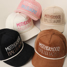 Motherhood Hallelujah corduroy rope trucker hat shown in all color options