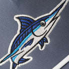 Blue Marlin rope strap trucker hat in navy and white, side view