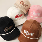 Blessed embroidered corduroy rope trucker hat shown in all color options