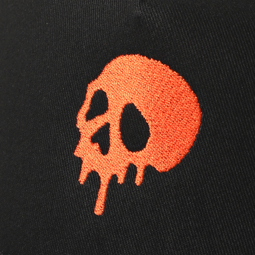 Skull Drip mesh trucker hat in black and orange, side view