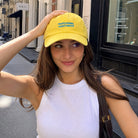 Model wearing Professional Overthinker washed baseball cap