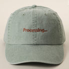 Processing embroidered baseball cap in green tea