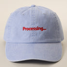 Processing embroidered baseball cap in sax blue