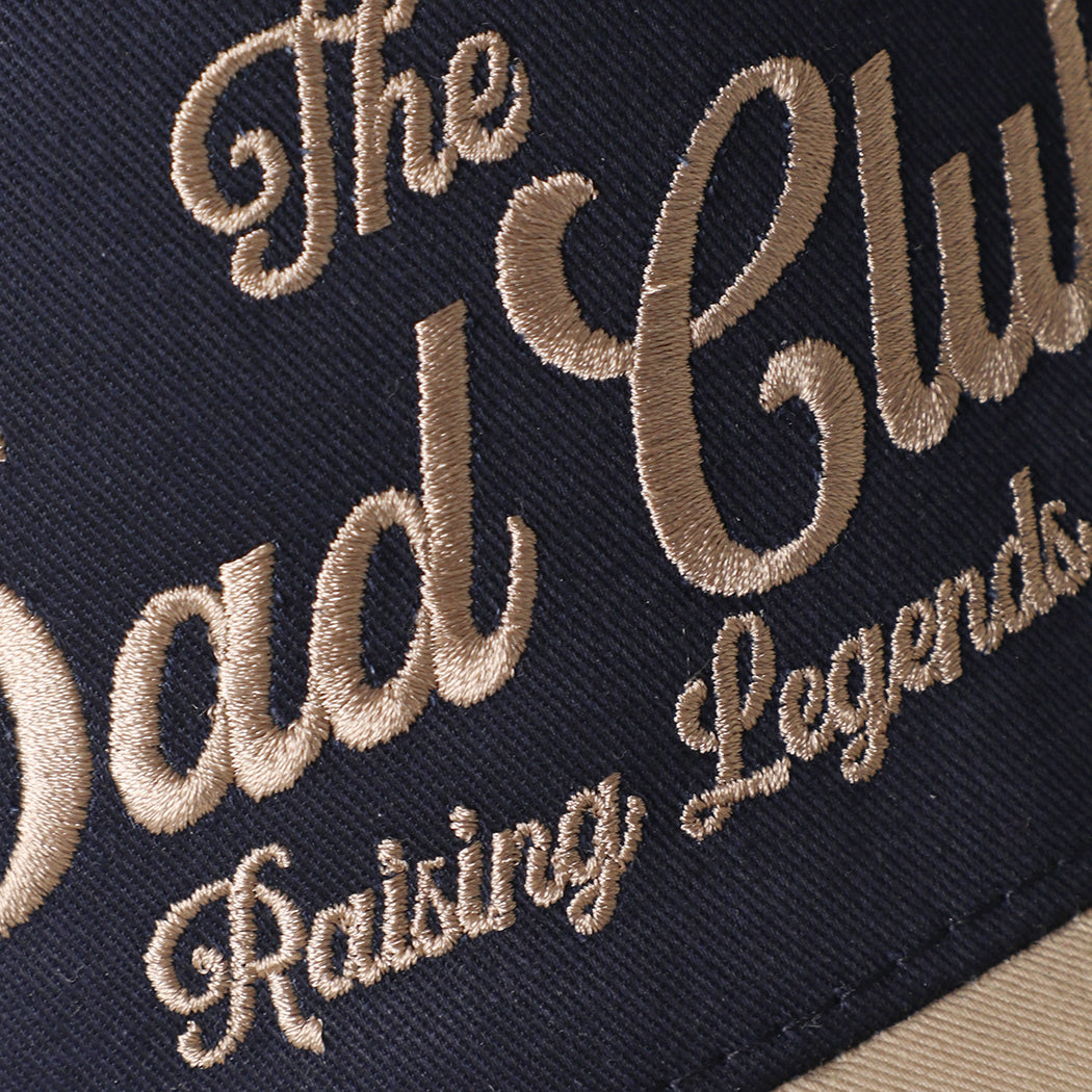 The Dad Club Raising Legends trucker hat in khaki and navy, side view