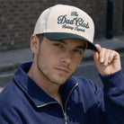 The Dad Club Raising Legends trucker hat, front view alternate angle