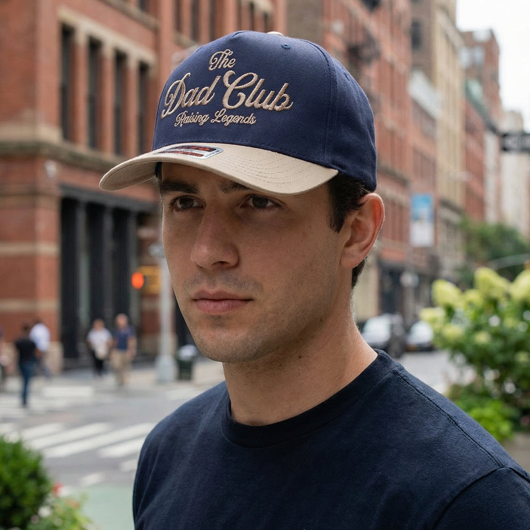 The Dad Club Raising Legends embroidered trucker hat, front view