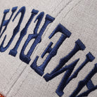 America Upside Down mid profile trucker hat in orange and heather grey, side view